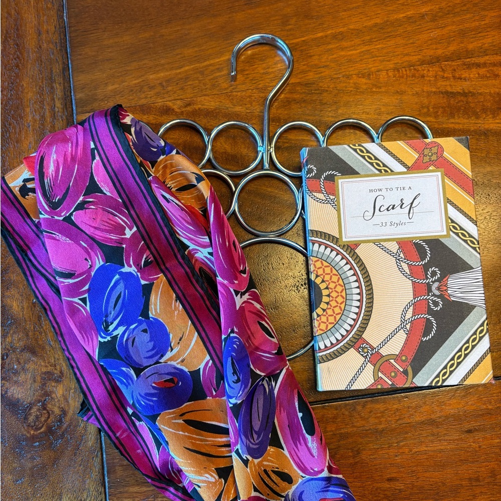 How To Tie A Scarf book with a beautiful scarf and a scarf hanger.